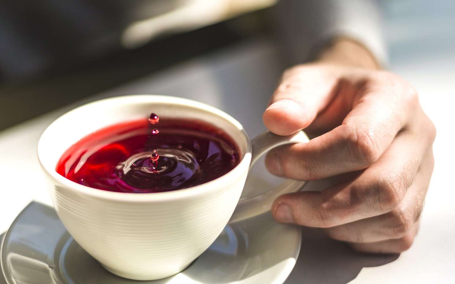 Cup of pure loose leaf tea representing intentional daily wellness ritual