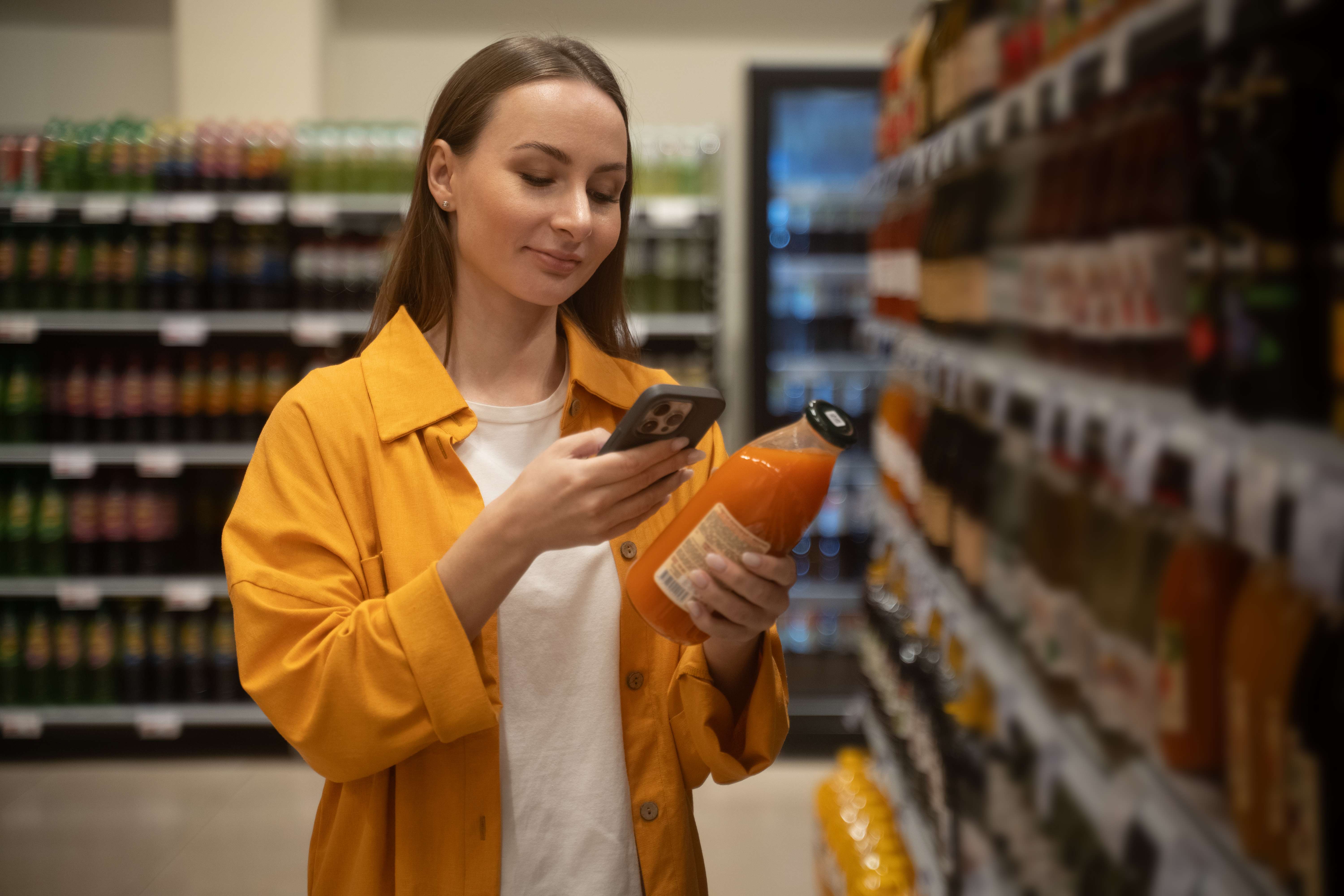 Consumer reading beverage ingredient label