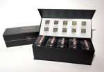The Pure Tea Experience gift box open, showing ten loose leaf tea blends and the square-sample lid card